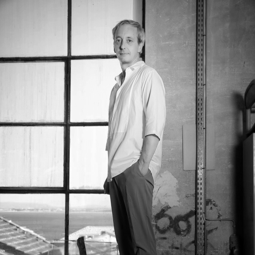 Black and white portrait of artist Sam Baron